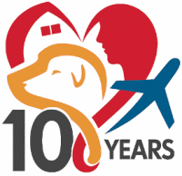 A black and white logo commemorating 10 years, featuring a heart shape incorporating elements like a house, a person's profile, an airplane, and a stylized number '10'.