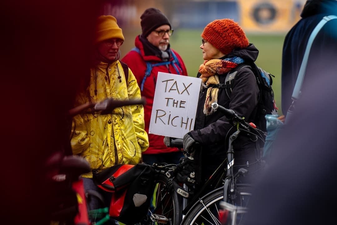 federal laws — A person in a wheelchair holding a sign