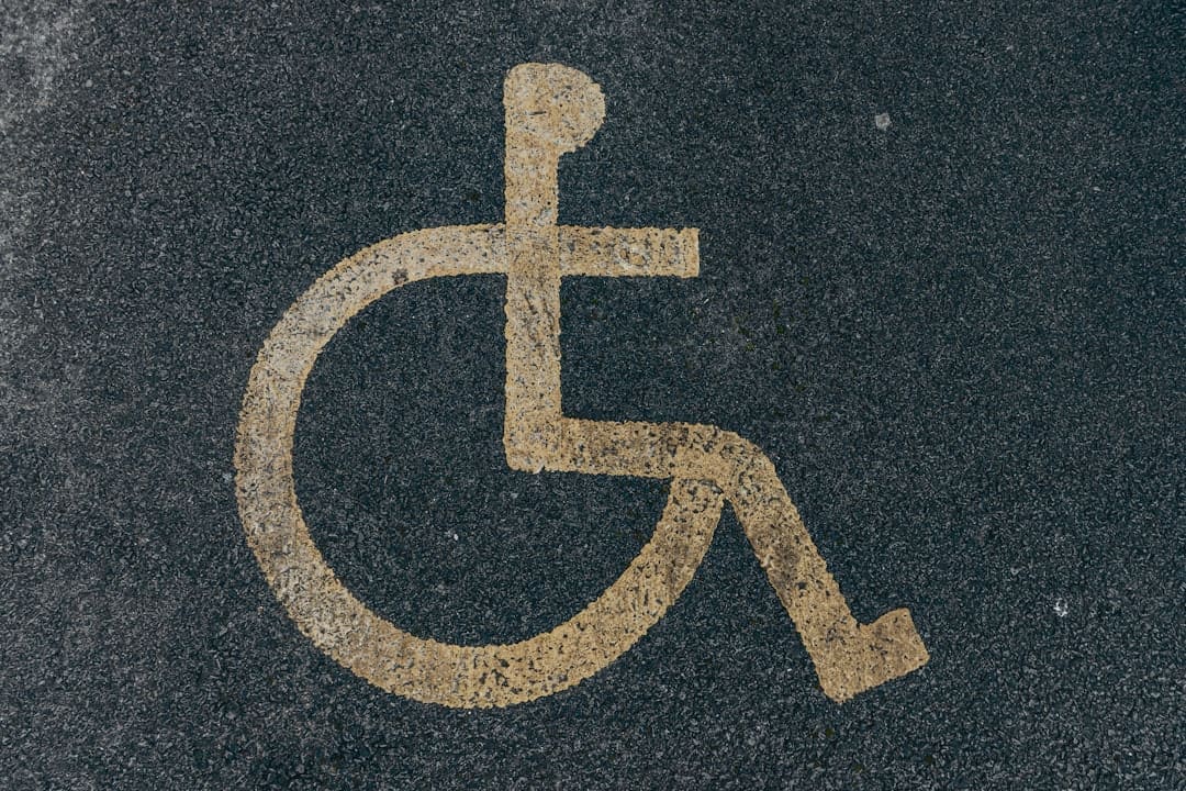 ADA service dog. A handicap sign painted on the ground